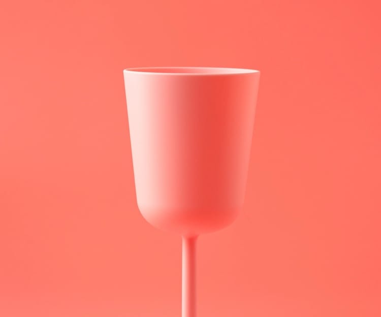 shampage glass in a soft red background